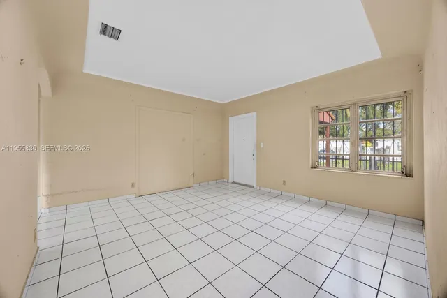 a view of an empty room and window