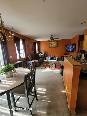 a workspace with furniture and a potted plant