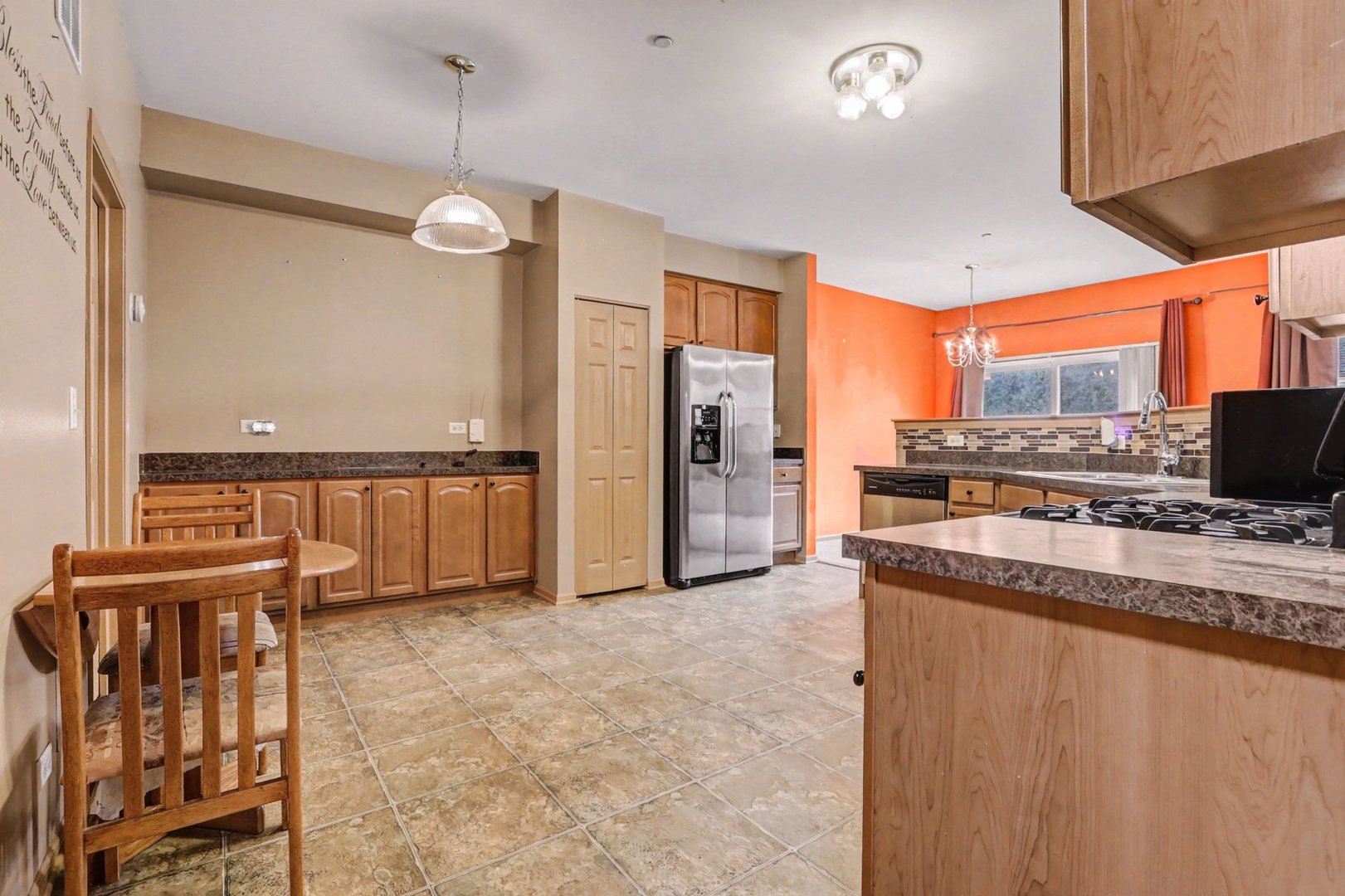 6503 Blue Sky Lane Matteson, IL 60443 - Photo 8 of 23 a large kitchen with stainless steel appliances granite countertop a refrigerator and a stove top oven