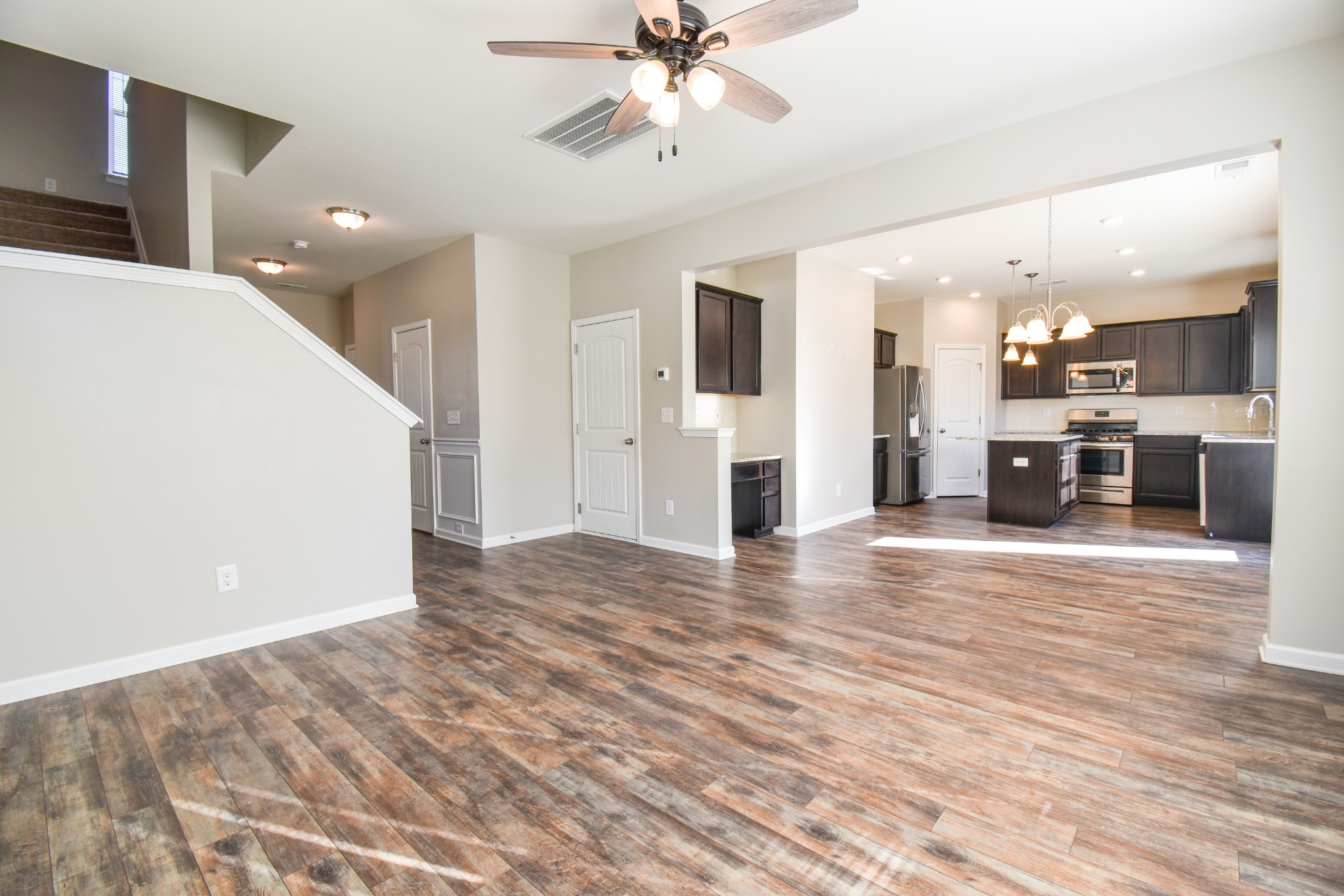 525 Burchell Lane Columbia, TN 38401 - Photo 14 of 29 a view of a kitchen with a sink and a refrigerator a fireplace