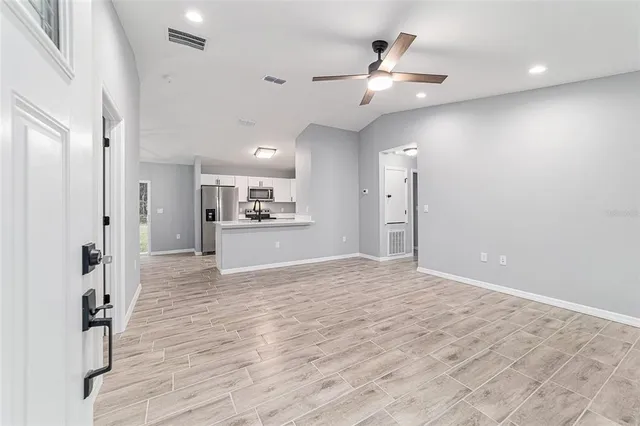 a view of kitchen with wooden floor and window