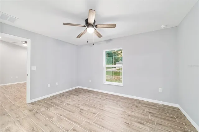 a bathroom with a sink a toilet a mirror and shower