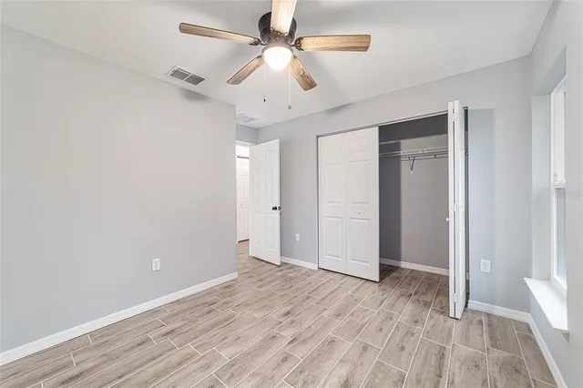 a view of hallway with wooden floor