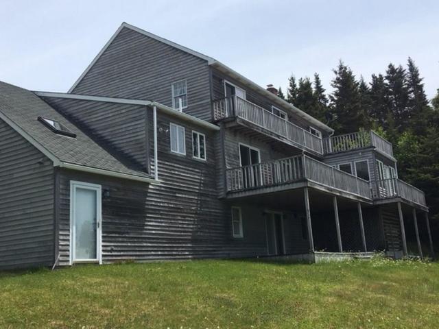 125 Jim's Head Road Lubec, ME 04652 - Photo 12 of 58 Back of the home showing all the decks