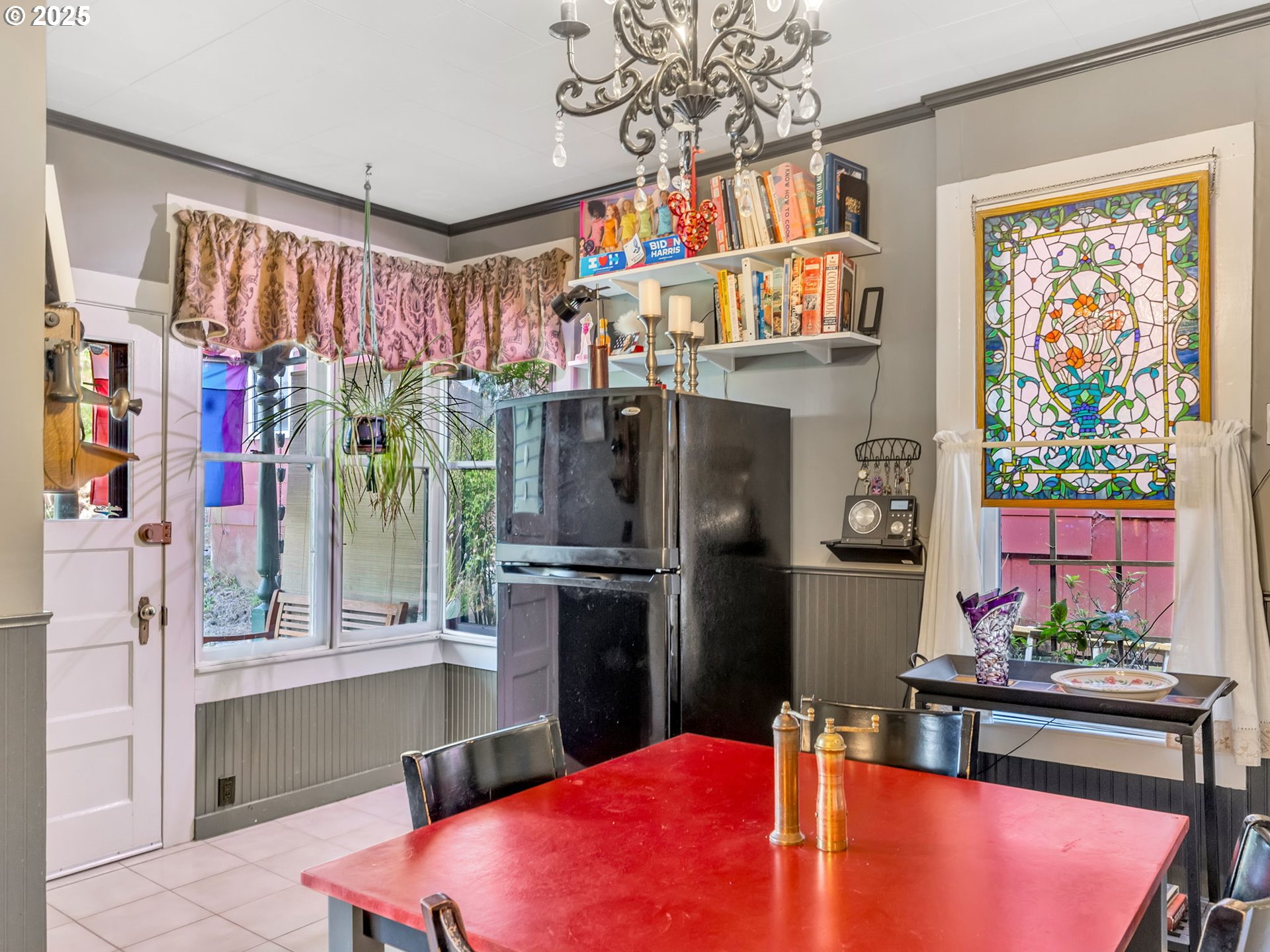 143 Washington Street Astoria, OR 97103 - Photo 16 of 45 a kitchen with stainless steel appliances kitchen island granite countertop a refrigerator and a table