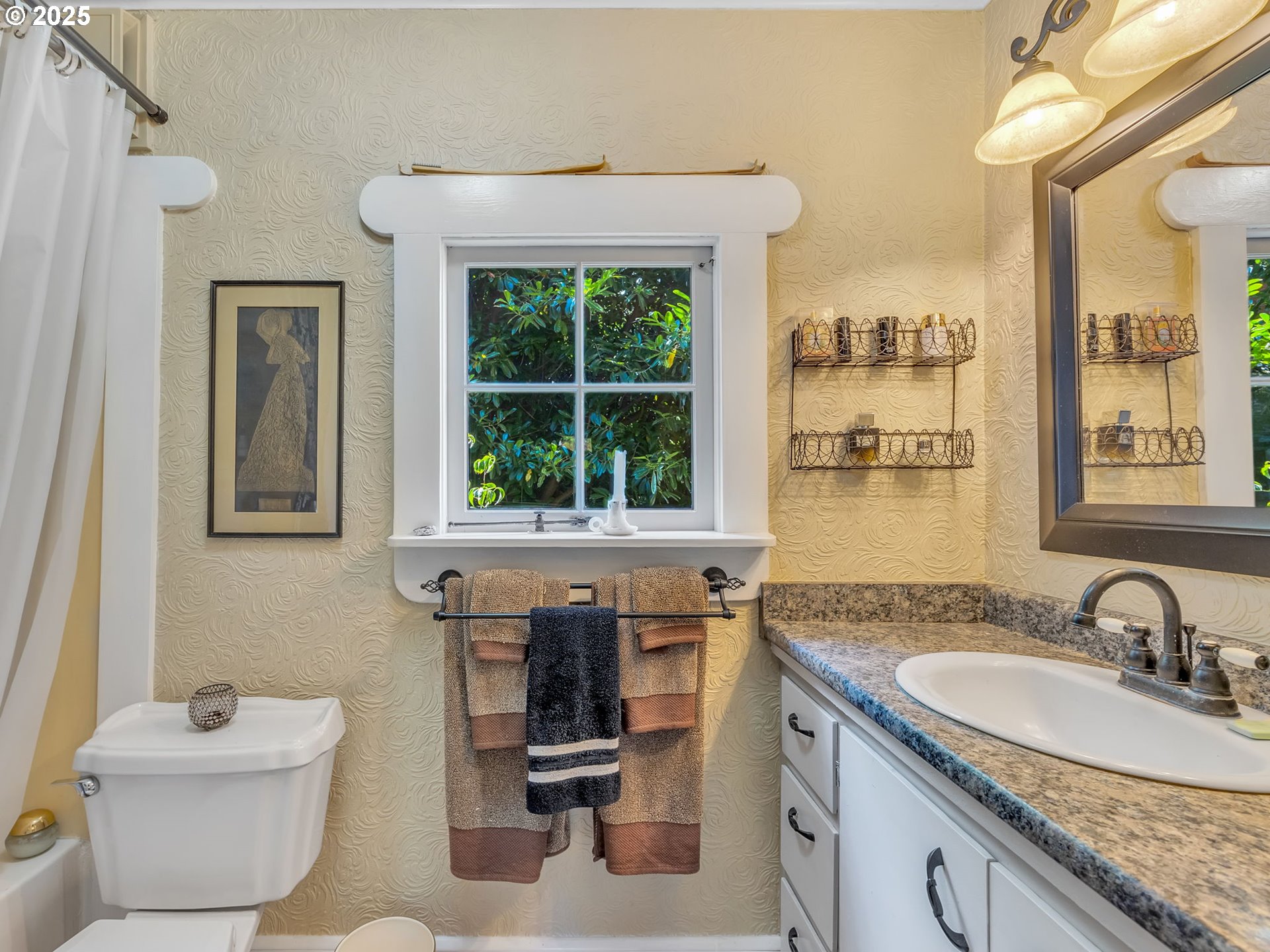 143 Washington Street Astoria, OR 97103 - Photo 19 of 45 a bathroom with a granite countertop sink and a toilet