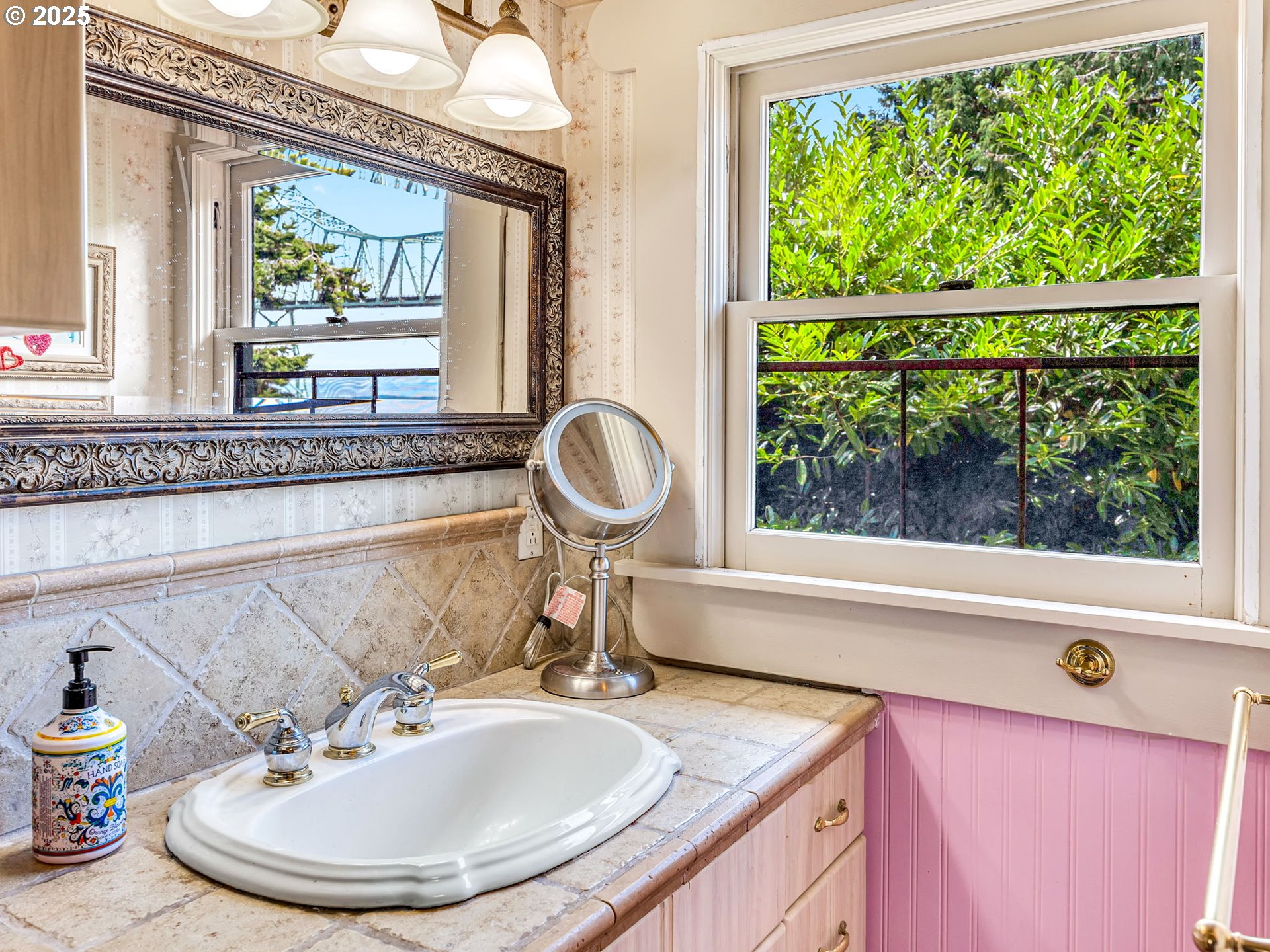 143 Washington Street Astoria, OR 97103 - Photo 30 of 45 a bathroom with a granite countertop sink and a window