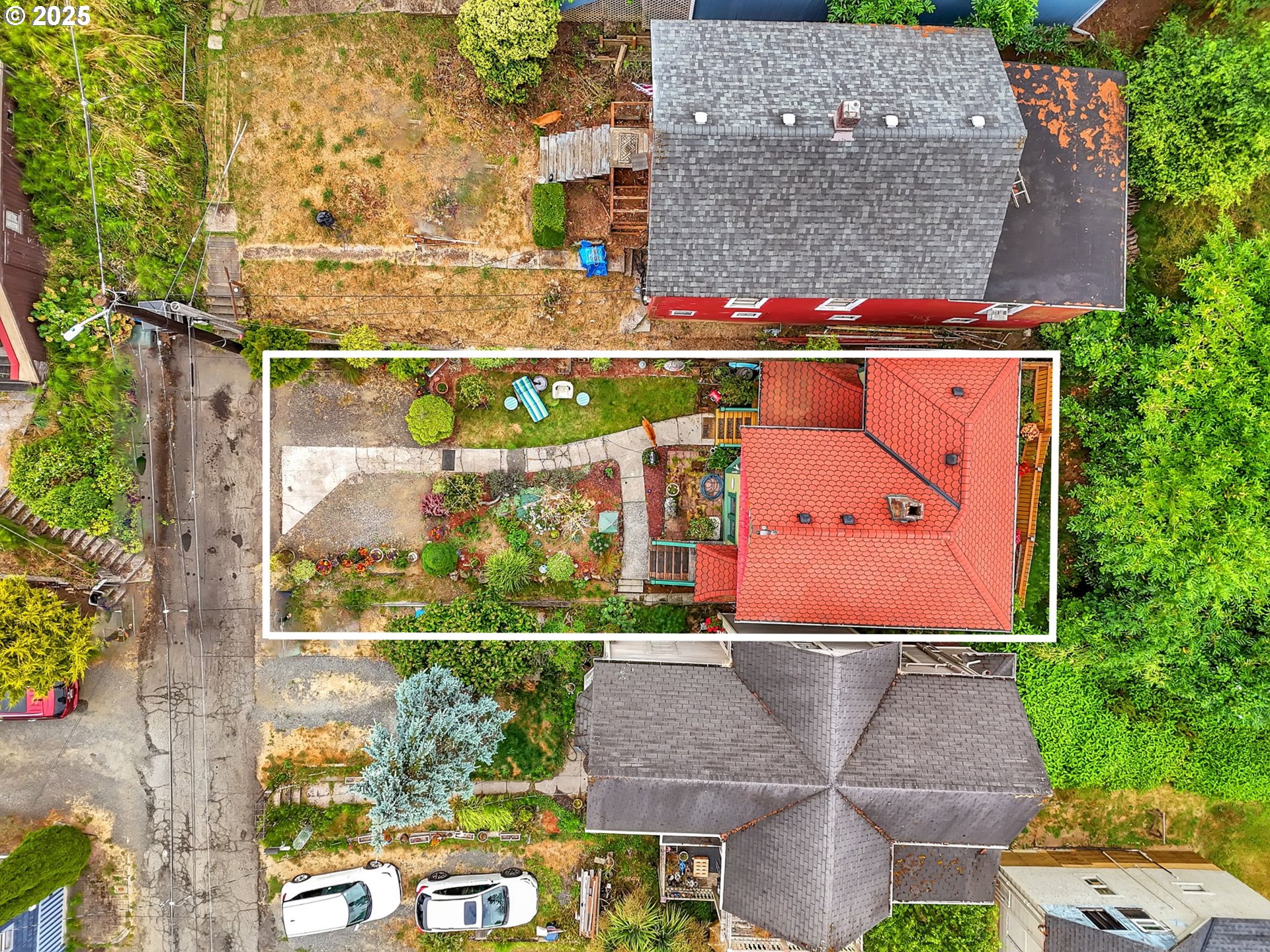 143 Washington Street Astoria, OR 97103 - Photo 43 of 45 an aerial view of multiple houses with a yard