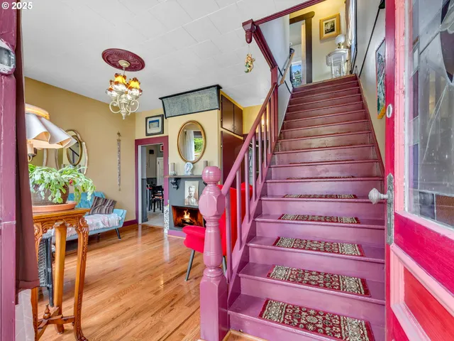 a view of entryway with stairs and wooden floor