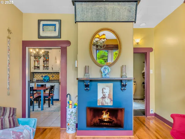 a living room with fireplace furniture and a fireplace