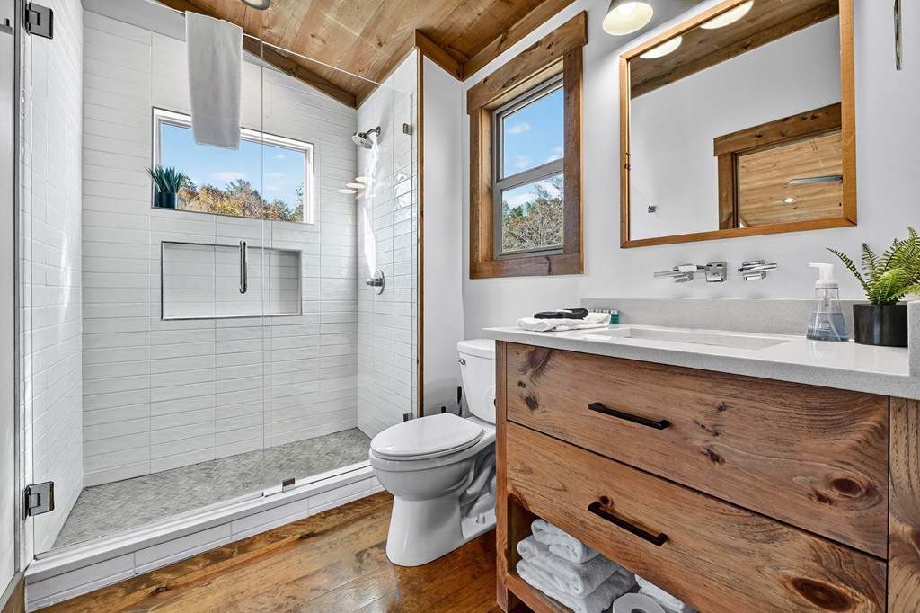 89 High Mdws Drive Morganton, GA 30560 - Photo 41 of 63 a bathroom with a sink and a mirror