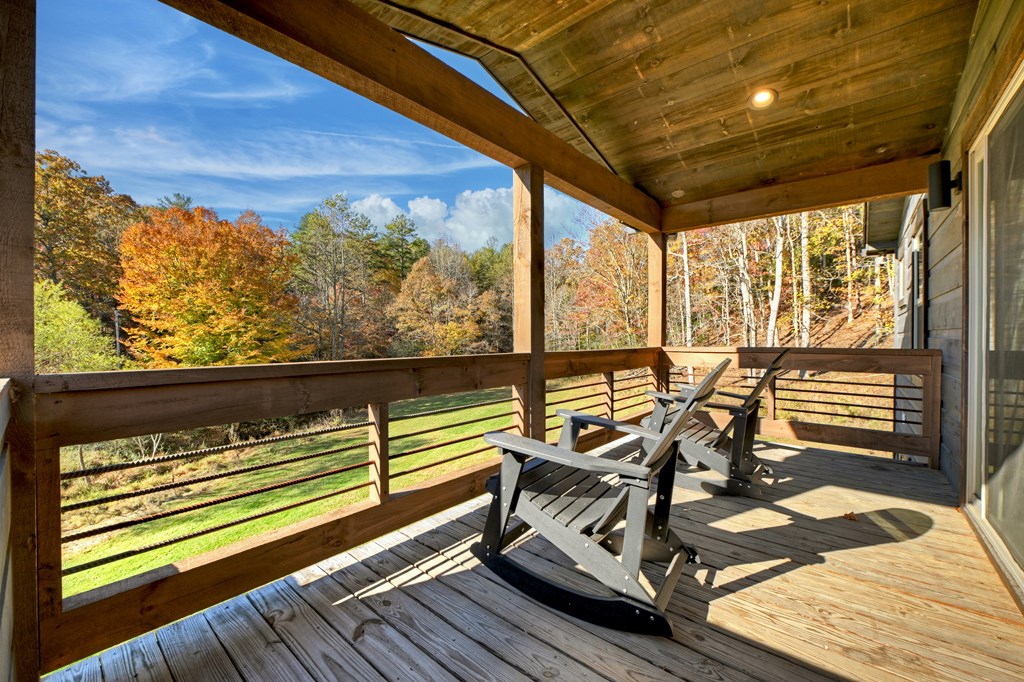89 High Mdws Drive Morganton, GA 30560 - Photo 43 of 63 a view of a balcony with chairs and wooden floor