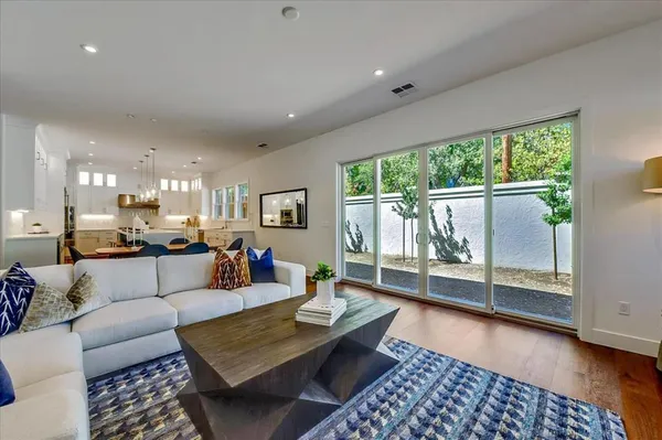 a living room with furniture and a table