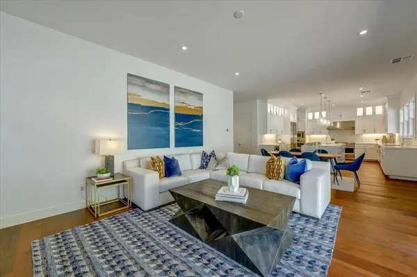 a living room with furniture and a rug