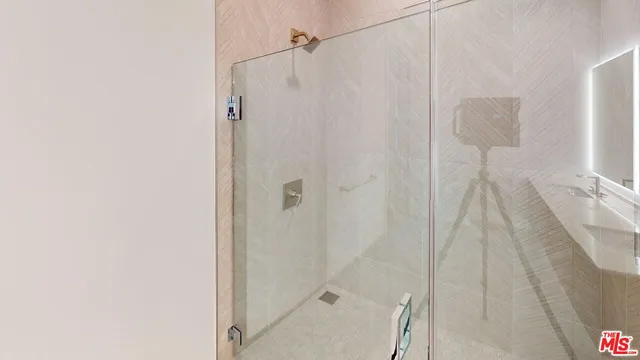 a bathroom with a shower curtain and a sink