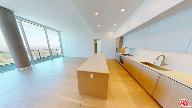 a kitchen with sink and cabinets