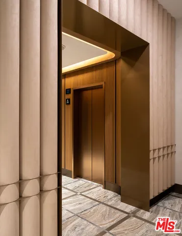 a bedroom with a bed and a mirror