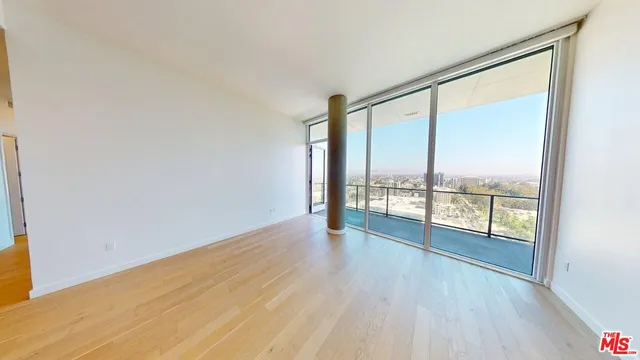 wooden floor in an empty room with window