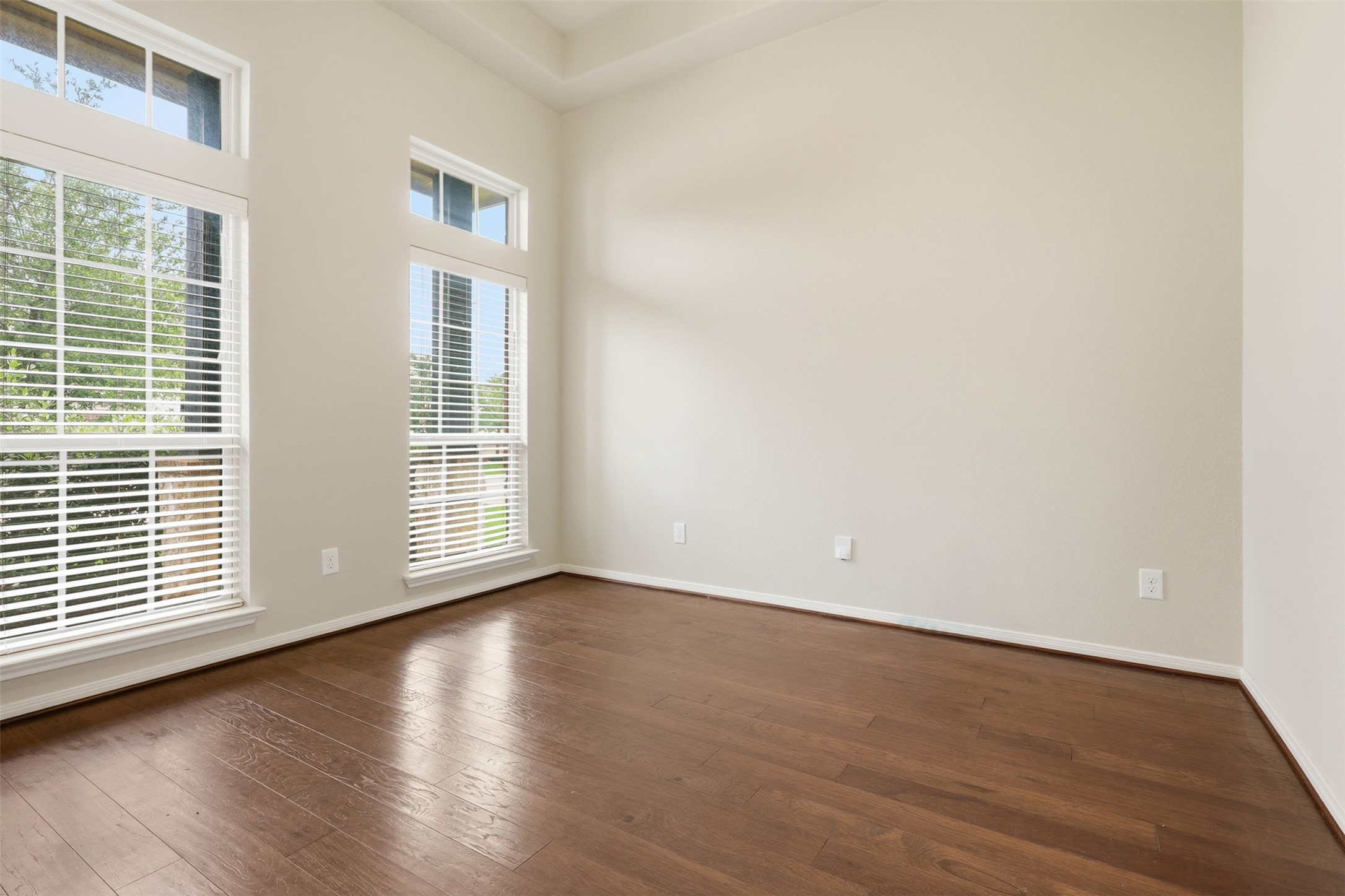 22943 Dale River Road Tomball, TX 77375 - Photo 4 of 29 a view of an empty room with wooden floor and windows