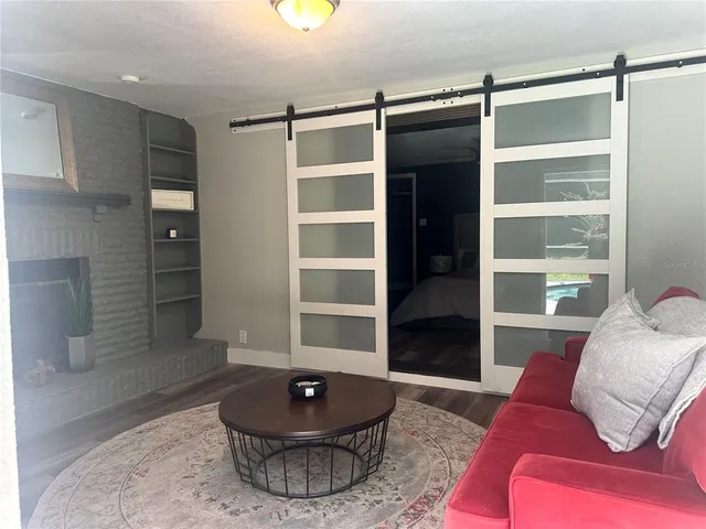 a living room with furniture and a rug