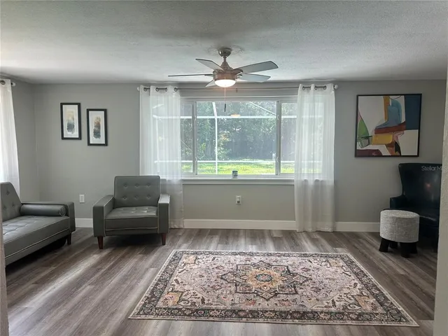 a living room with furniture and a rug