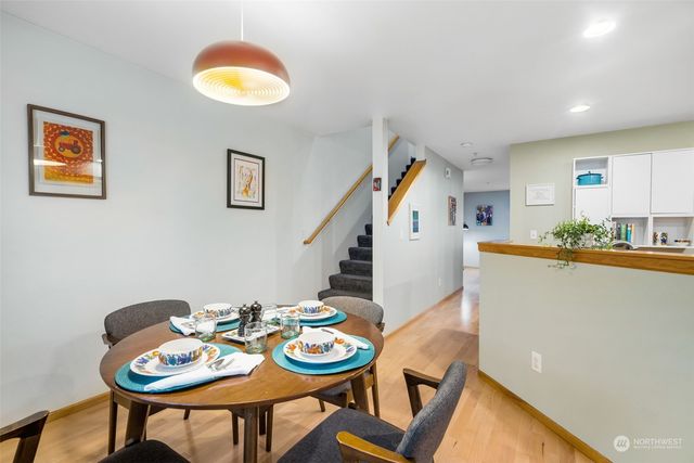 a view of a dining room with furniture and wooden floor