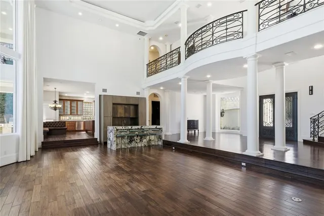 a lobby with furniture and wooden floor