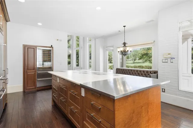 a room with counter top space and wooden floor