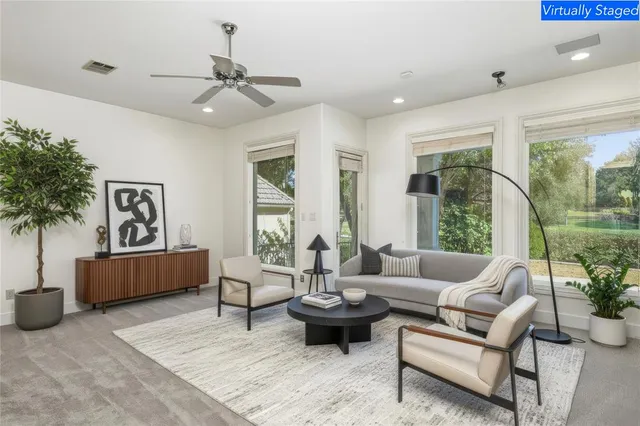 a living room with furniture and a large window