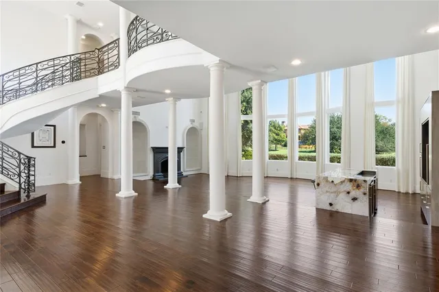 a view of an entryway with wooden floor and windows