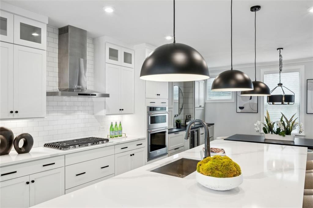 2090 Emmet Park Lane, Unit 425 Decatur, GA 30033 - Photo 24 of 102 a kitchen with stainless steel appliances a counter space a stove and cabinets