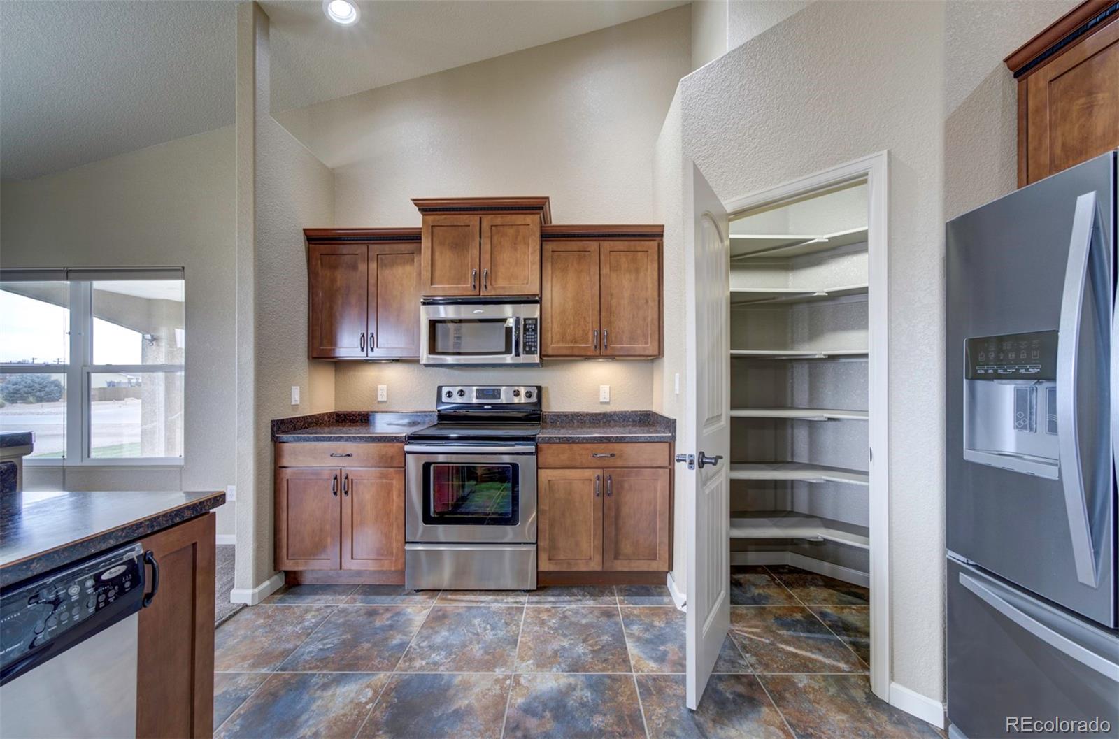 24484 Gale Road Pueblo, CO 81006 - Photo 15 of 43 a kitchen with a stove oven and a sink