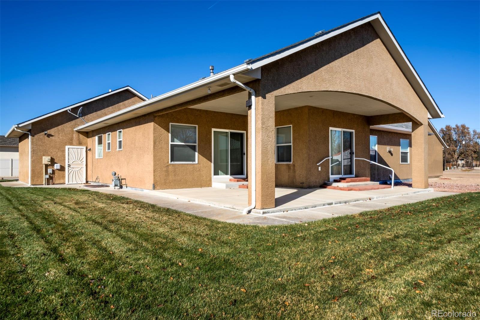 24484 Gale Road Pueblo, CO 81006 - Photo 2 of 43 a view of a house with a big yard and large tree