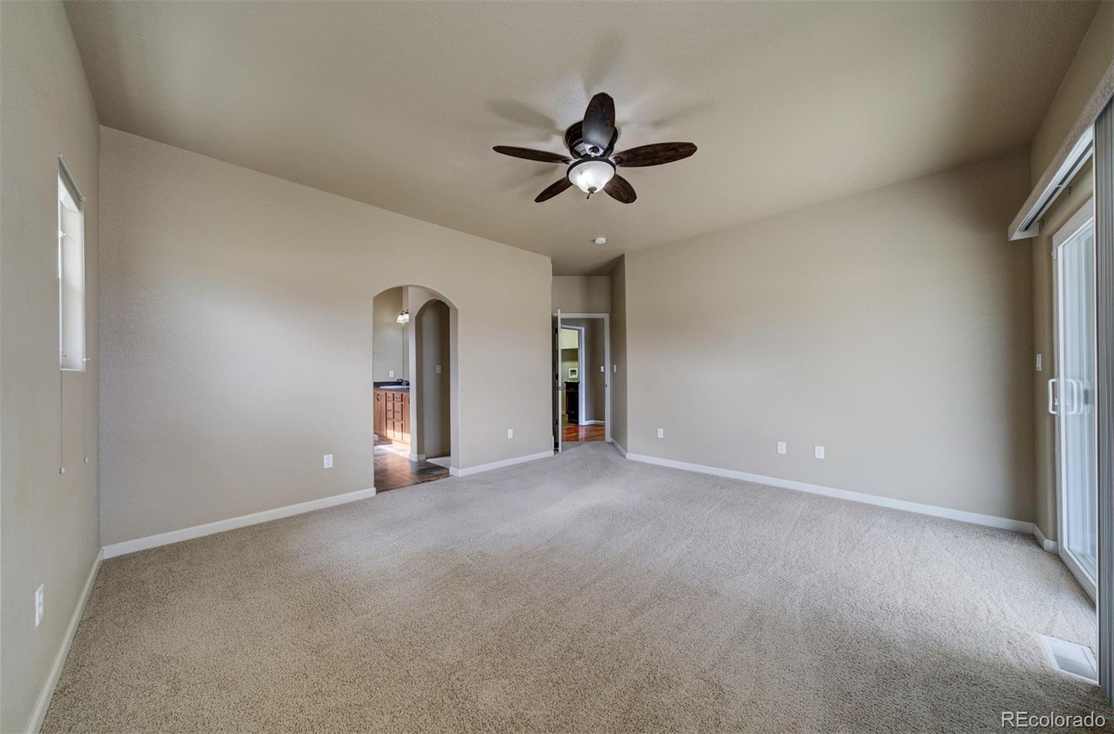 24484 Gale Road Pueblo, CO 81006 - Photo 23 of 43 a view of a livingroom with a ceiling fan and window