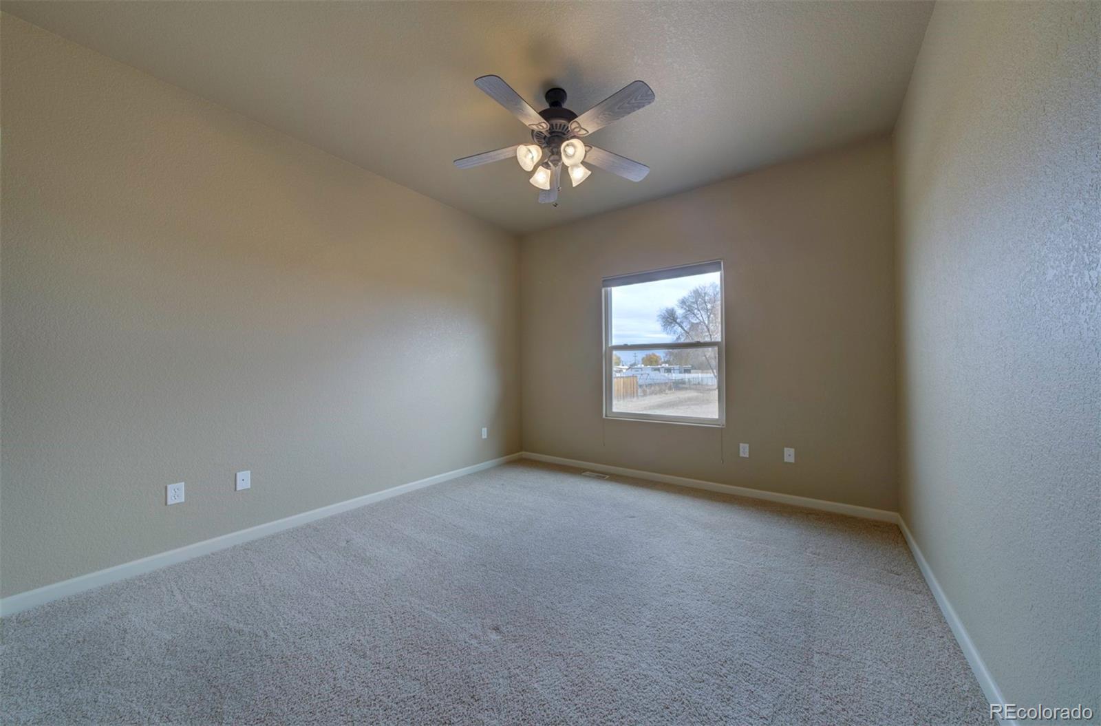 24484 Gale Road Pueblo, CO 81006 - Photo 31 of 43 a view of an empty room with a window