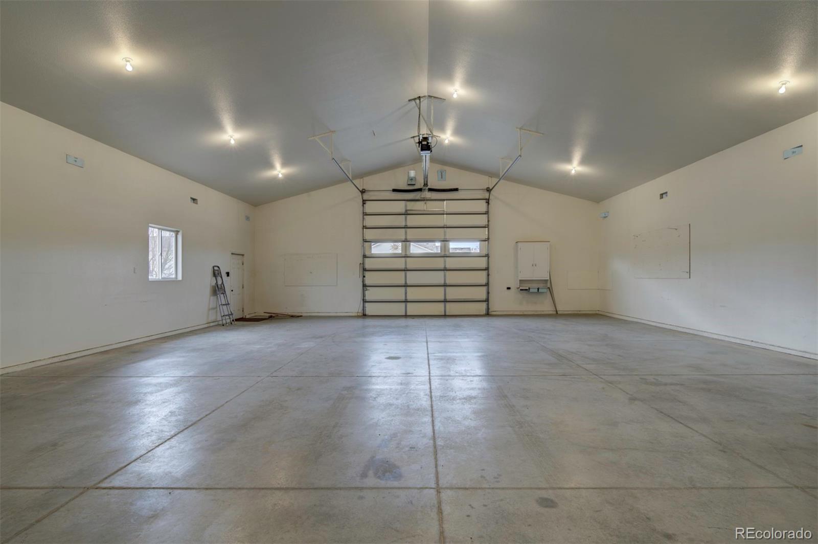 24484 Gale Road Pueblo, CO 81006 - Photo 9 of 43 an empty room with windows and natural light