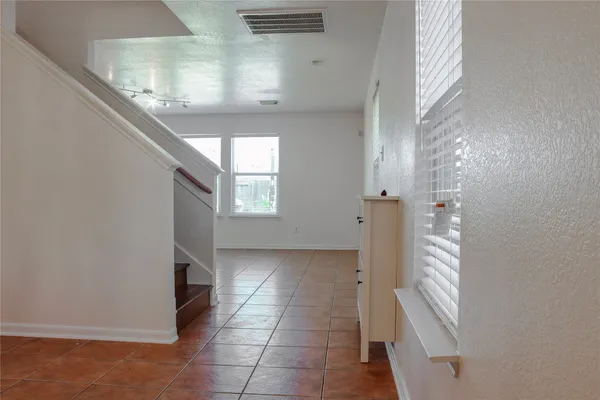 a view of entryway with kitchen