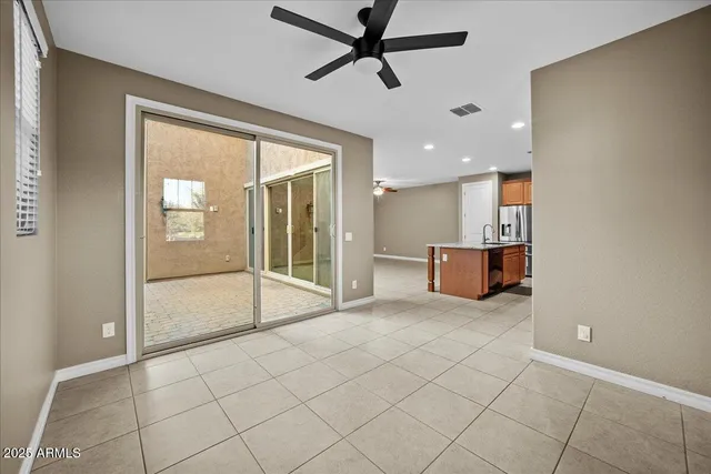a kitchen with stainless steel appliances granite countertop a refrigerator and a stove top oven