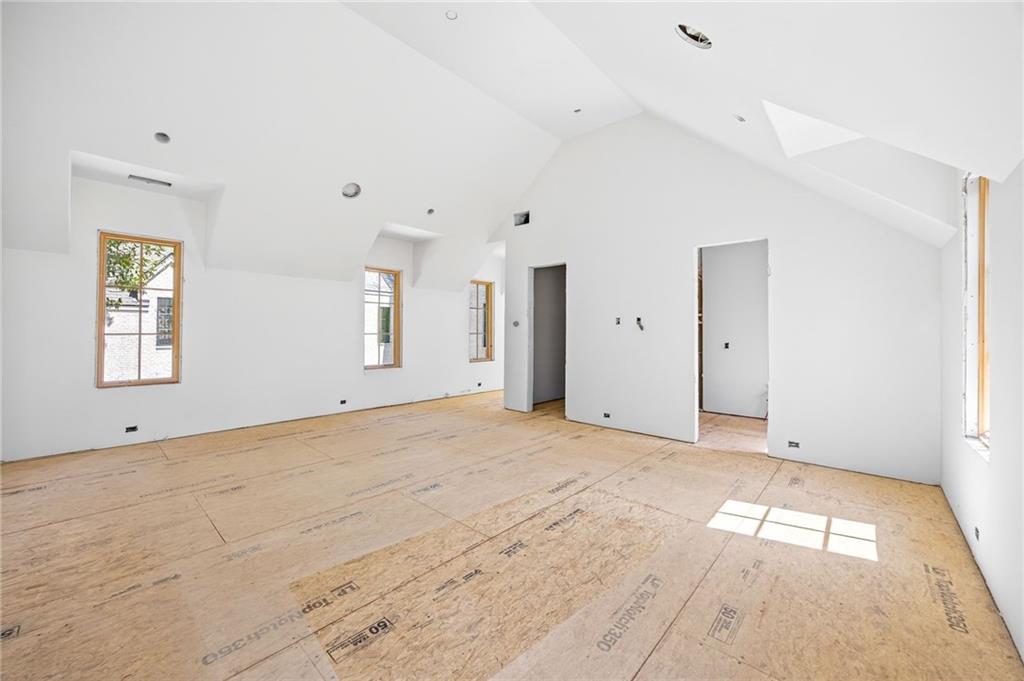 312 Blackland Road Northwest Atlanta, GA 30342 - Photo 16 of 58 a view of empty room with wooden floor and windows
