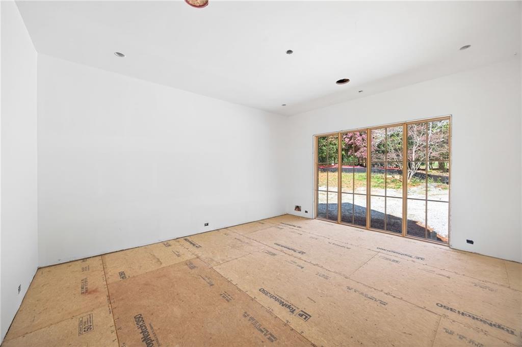312 Blackland Road Northwest Atlanta, GA 30342 - Photo 18 of 58 a view of an empty room with a window