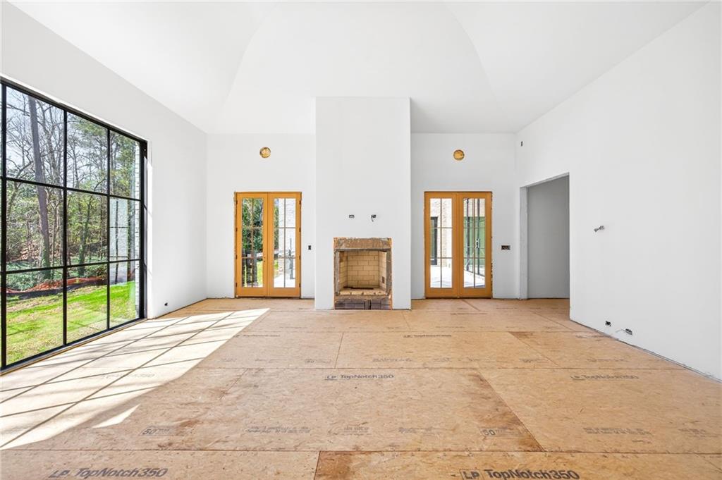 312 Blackland Road Northwest Atlanta, GA 30342 - Photo 24 of 58 a view of an empty room with window and a kitchen