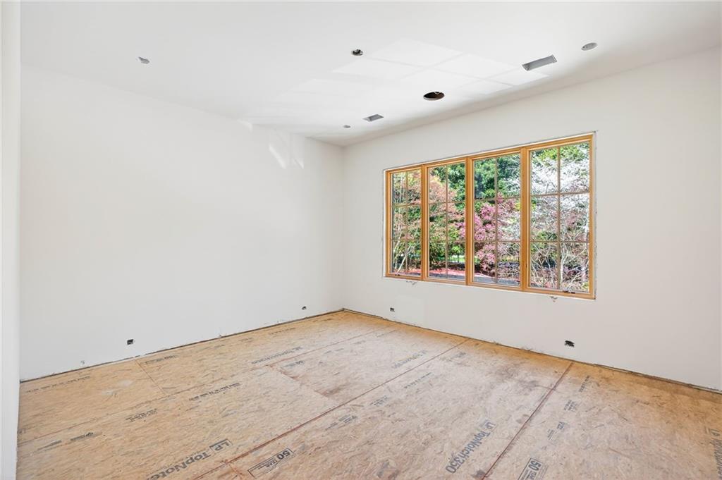 312 Blackland Road Northwest Atlanta, GA 30342 - Photo 32 of 58 an empty room with a window