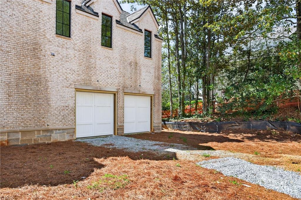 312 Blackland Road Northwest Atlanta, GA 30342 - Photo 50 of 58 a front view of a house with a yard