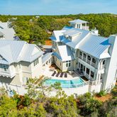 a view of a roof deck with wooden floor and city view