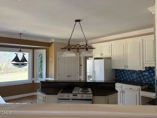 a kitchen with a sink and a refrigerator