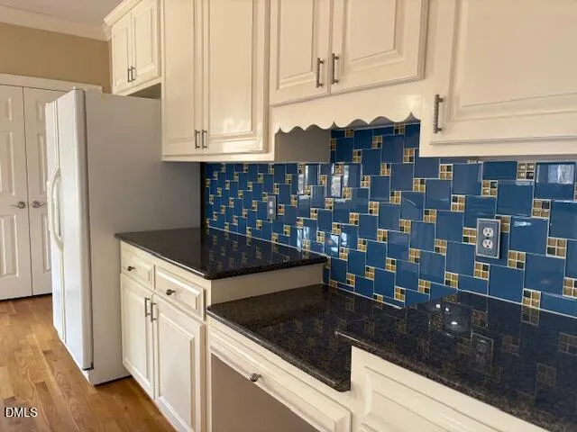 a kitchen with stainless steel appliances granite countertop a stove a sink and a window