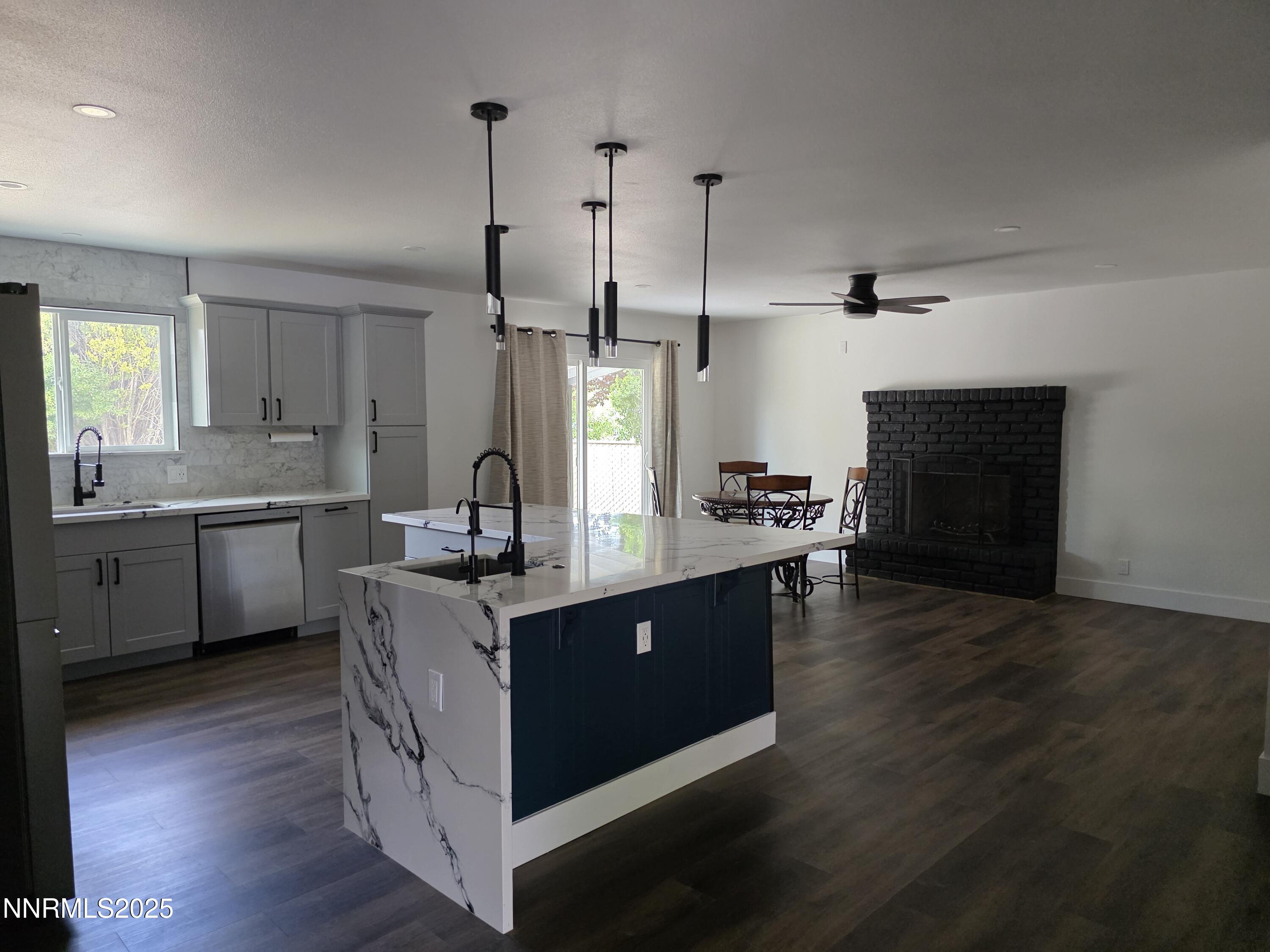 3280 Everett Drive Reno, NV 89503 - Photo 1 of 9 a kitchen with stainless steel appliances granite countertop a sink stove and wooden floor