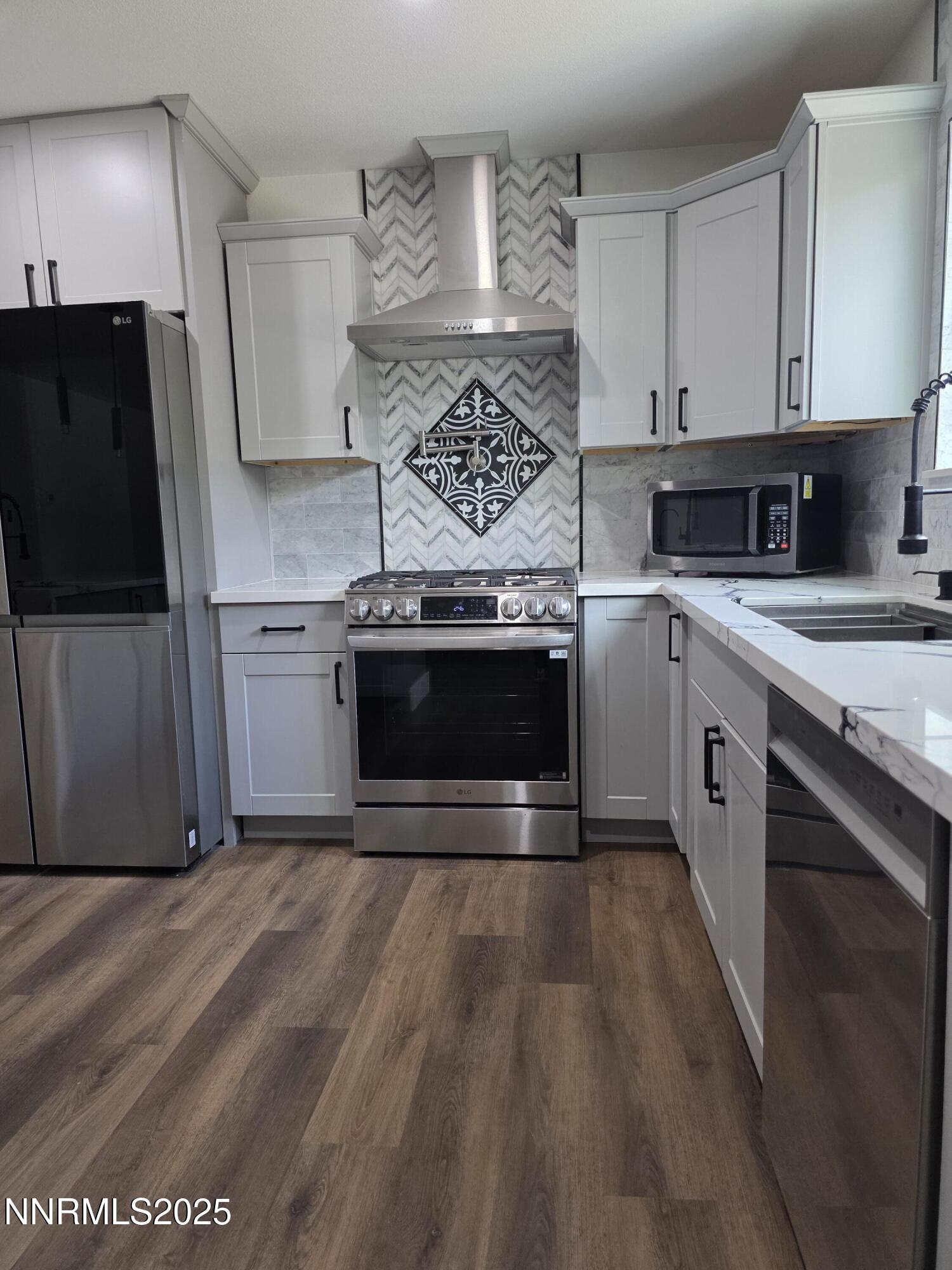 3280 Everett Drive Reno, NV 89503 - Photo 2 of 9 a kitchen with stainless steel appliances granite countertop a stove a sink and a refrigerator