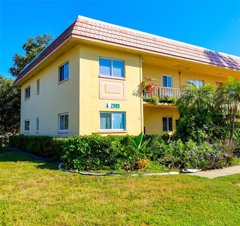 a front view of house with yard and trees