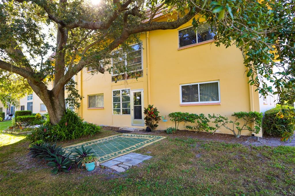 2003 Greenbriar Boulevard, Unit 1 Clearwater, FL 33763 - Photo 5 of 20 a front view of a house with garden